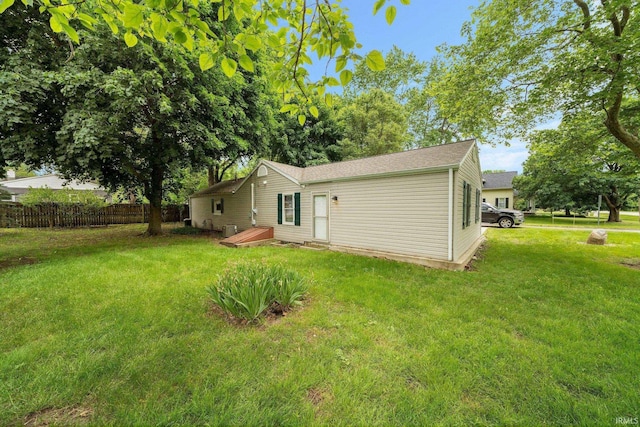 51662 Kenilworth Rd, South Bend, IN 46637 - back of house with central AC unit and a shingled roof