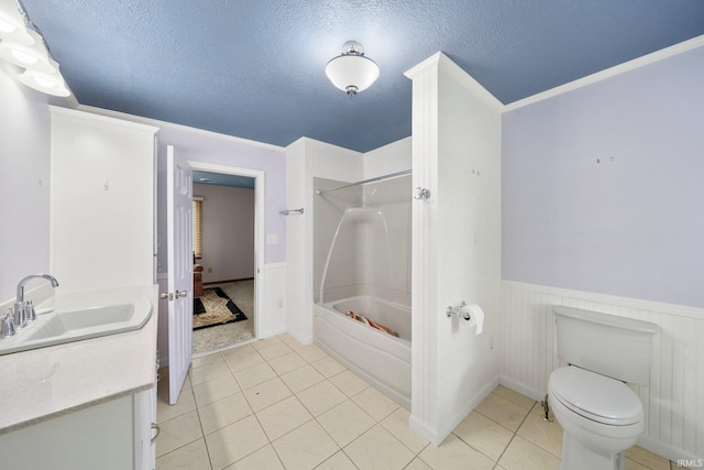 51662 Kenilworth Rd, South Bend, IN 46637 - bathroom featuring vanity, toilet, a wainscoted wall, shower / bathtub combination, and tile patterned floors