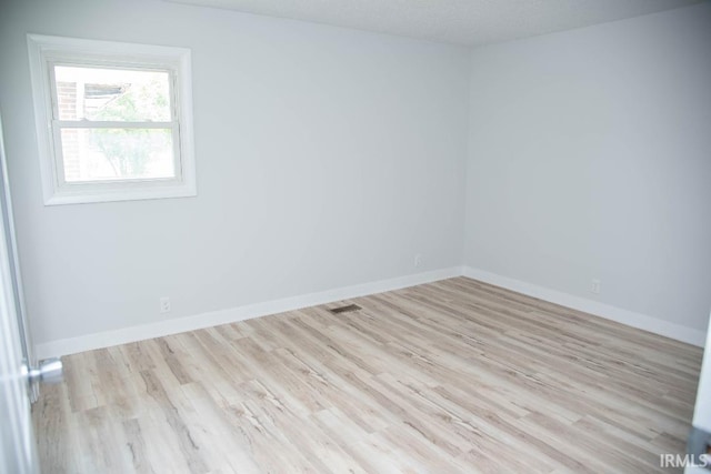 1105 W Tilmor Dr, Muncie, IN 47303 - spare room with wood finished floors and baseboards
