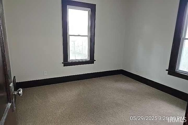 121 Altgeld St, South Bend, IN 46614 - carpeted empty room featuring plenty of natural light and baseboards