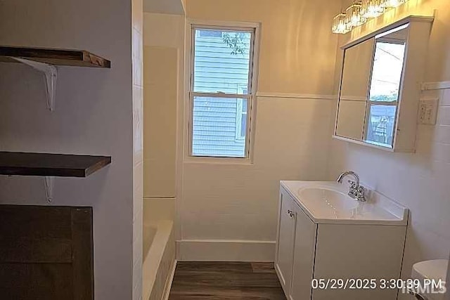 121 Altgeld St, South Bend, IN 46614 - bathroom with plenty of natural light, vanity, wood finished floors, and baseboards