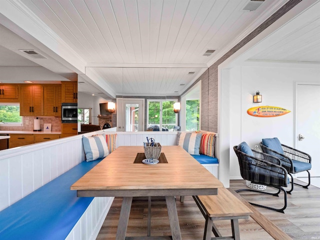 10660 N Southshore Dr Unit D3, Syracuse, IN 46567 - dining room featuring light wood-type flooring, healthy amount of natural light, wooden ceiling, breakfast area, and ornamental molding
