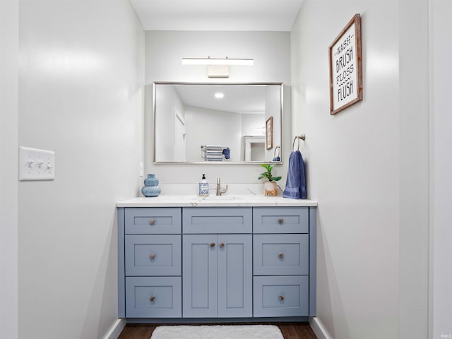 10660 N Southshore Dr Unit D3, Syracuse, IN 46567 - bathroom with vanity, wood finished floors, and baseboards