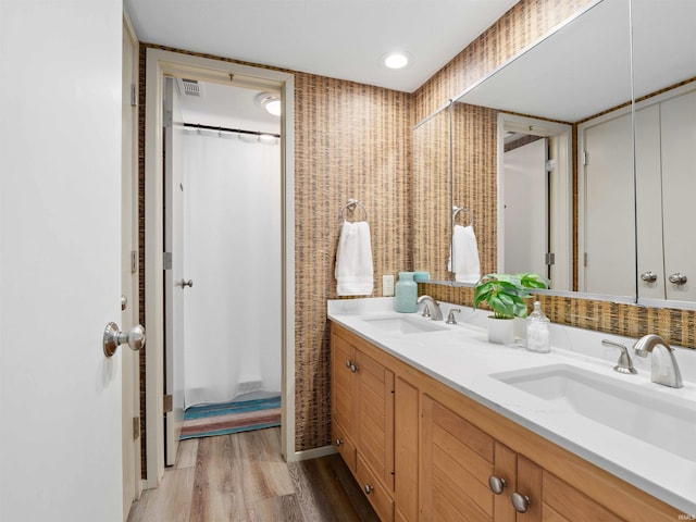 10660 N Southshore Dr Unit D3, Syracuse, IN 46567 - bathroom with double vanity, wood finished floors, and curtained shower