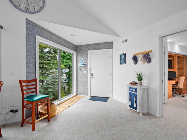 10660 N Southshore Dr Unit D3, Syracuse, IN 46567 - foyer featuring vaulted ceiling, carpet, and baseboards