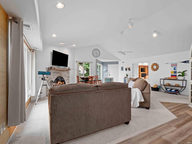 10660 N Southshore Dr Unit D3, Syracuse, IN 46567 - living area with a fireplace, lofted ceiling, light wood-style floors, a ceiling fan, and recessed lighting