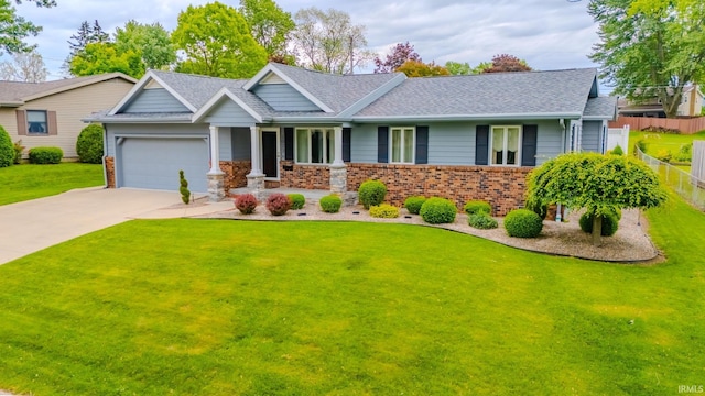 1023 Sunset Dr, Wabash, IN 46992 - view of front of house featuring an attached garage, brick siding, a shingled roof, and driveway