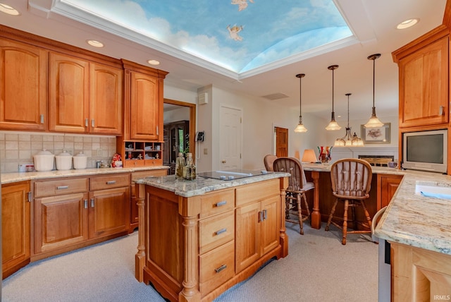 1023 Sunset Dr, Wabash, IN 46992 - kitchen with light carpet, black electric cooktop, light stone countertops, decorative light fixtures, and decorative backsplash