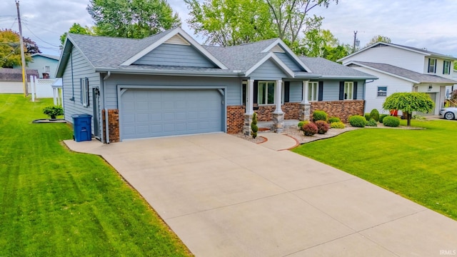 1023 Sunset Dr, Wabash, IN 46992 - view of front facade with an attached garage, roof with shingles, brick siding, and a front yard