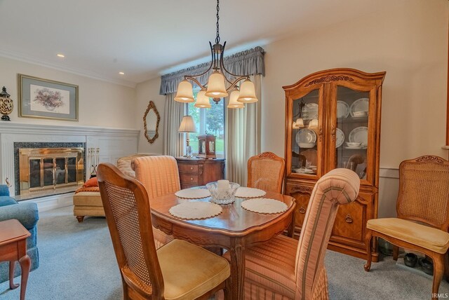 1023 Sunset Dr, Wabash, IN 46992 - carpeted dining space with a high end fireplace, recessed lighting, a chandelier, and crown molding