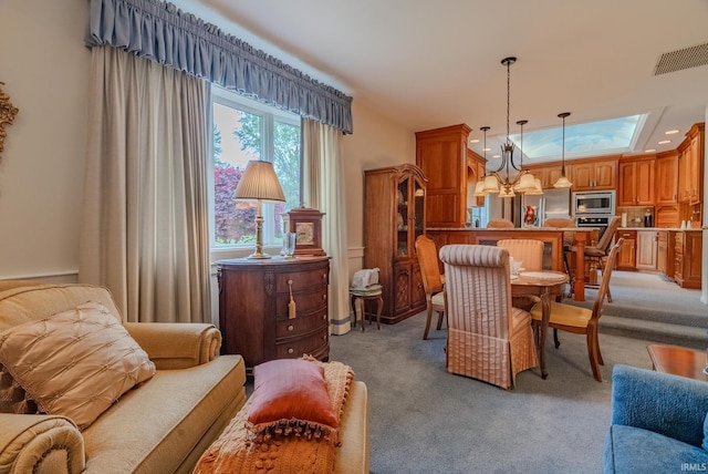 1023 Sunset Dr, Wabash, IN 46992 - living area featuring light carpet and a chandelier