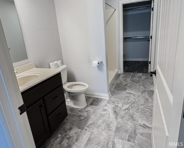 3981 Gussie Ct, Warsaw, IN 46582 - bathroom with vanity, a shower, baseboards, and toilet