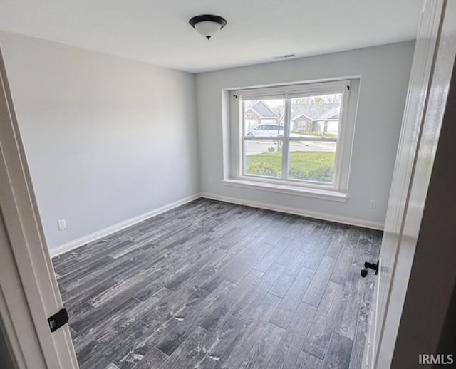 3981 Gussie Ct, Warsaw, IN 46582 - empty room with dark wood finished floors and baseboards