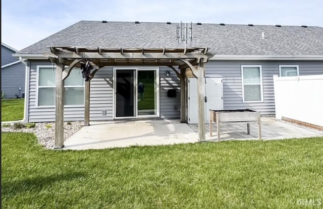 3981 Gussie Ct, Warsaw, IN 46582 - rear view of house with a patio area, a pergola, and a shingled roof