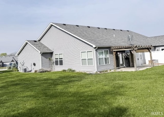 3981 Gussie Ct, Warsaw, IN 46582 - back of house with a pergola, a patio, a yard, central AC, and a shingled roof