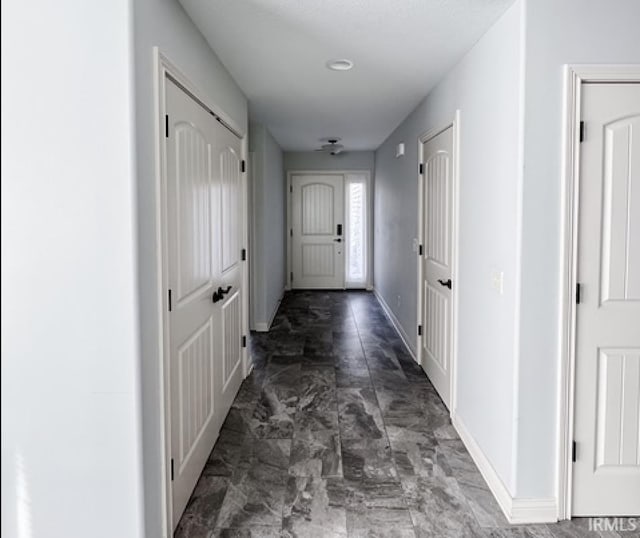 3981 Gussie Ct, Warsaw, IN 46582 - hall with baseboards and marble look tiles