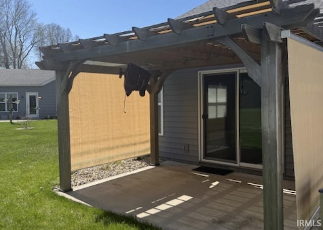 3981 Gussie Ct, Warsaw, IN 46582 - view of exterior entry with a patio, a pergola, and a yard