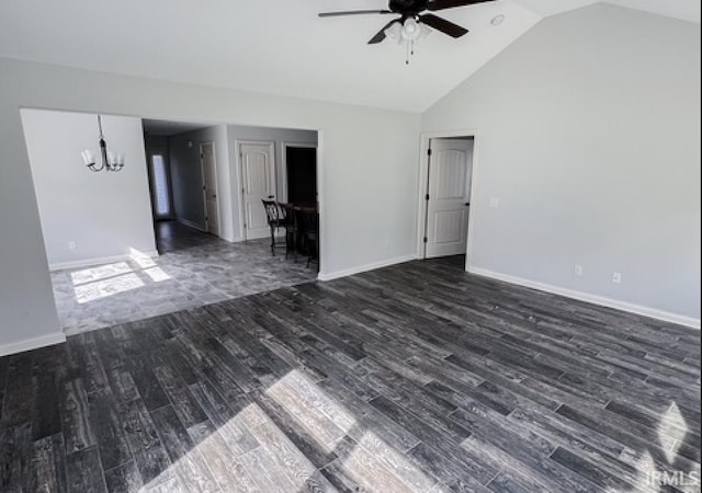 3981 Gussie Ct, Warsaw, IN 46582 - spare room with a ceiling fan, a chandelier, dark wood-style floors, vaulted ceiling, and baseboards