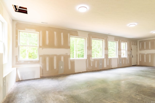 2075 N Russell Rd, Bloomington, IN 47408 - unfurnished room featuring healthy amount of natural light and concrete flooring