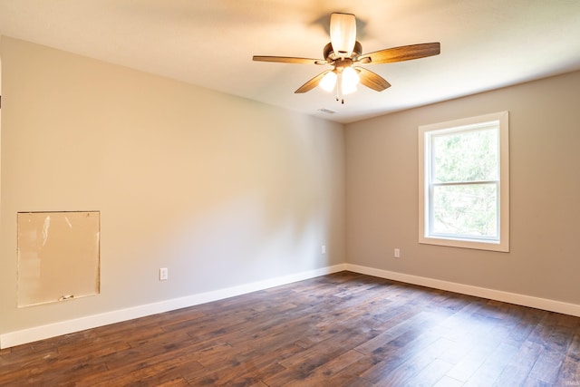 2075 N Russell Rd, Bloomington, IN 47408 - unfurnished room featuring a ceiling fan, dark wood finished floors, and baseboards