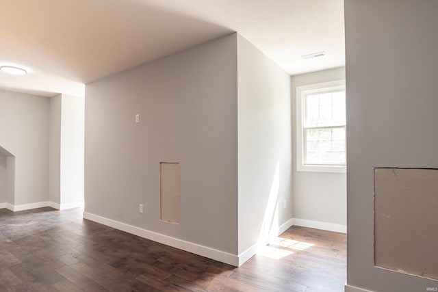 2075 N Russell Rd, Bloomington, IN 47408 - spare room featuring dark wood-style floors and baseboards