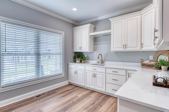 1595 Victoria Woods Dr, Boonville, IN 47601 - kitchen featuring a sink, white cabinetry, light wood finished floors, ornamental molding, and recessed lighting
