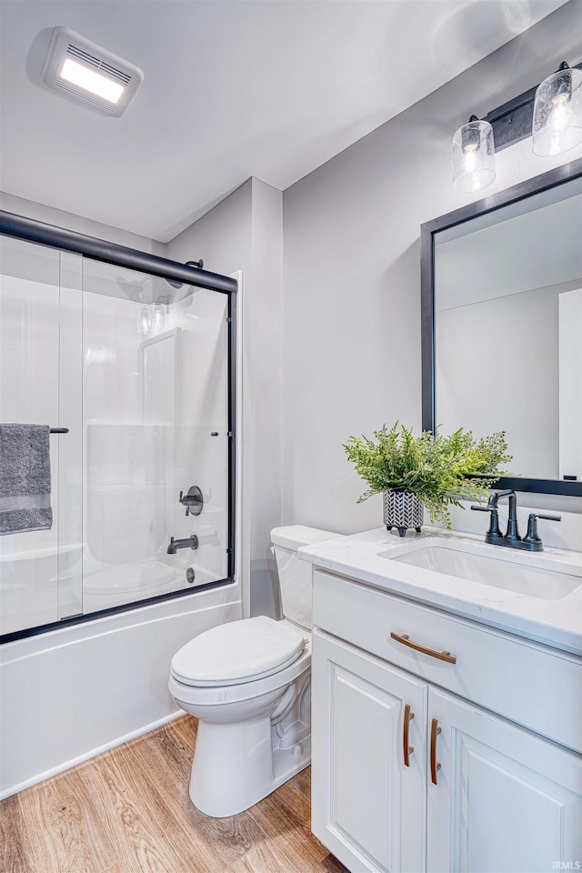 1595 Victoria Woods Dr, Boonville, IN 47601 - full bathroom with vanity, toilet, wood finished floors, and combined bath / shower with glass door