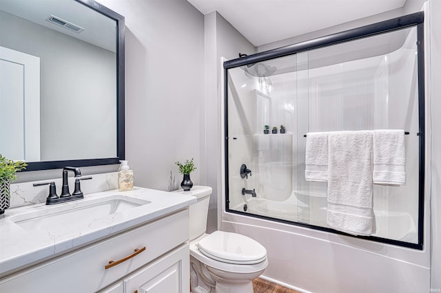 1595 Victoria Woods Dr, Boonville, IN 47601 - bathroom featuring vanity, bath / shower combo with glass door, toilet, and wood finished floors