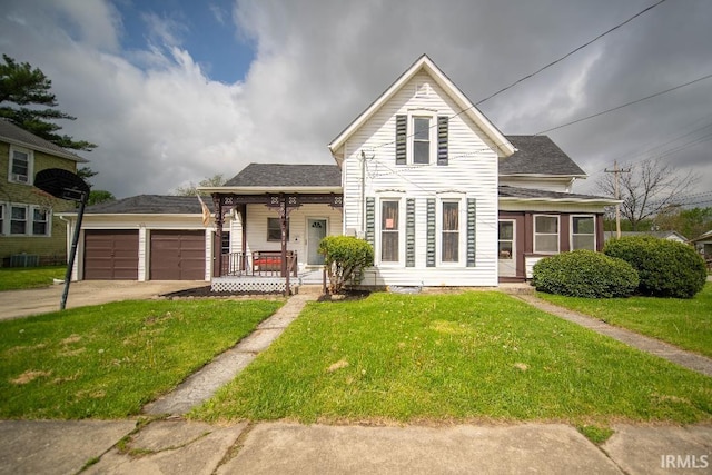 819 Spring St, New Castle, IN 47362 - traditional home featuring covered porch, driveway, a front lawn, and an attached garage