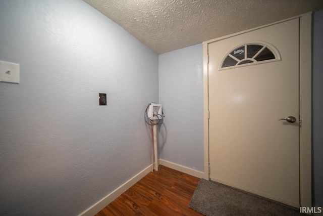 819 Spring St, New Castle, IN 47362 - hall with a textured ceiling, wood finished floors, and baseboards