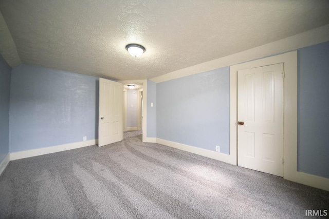 819 Spring St, New Castle, IN 47362 - spare room with a textured ceiling, baseboards, and carpet flooring