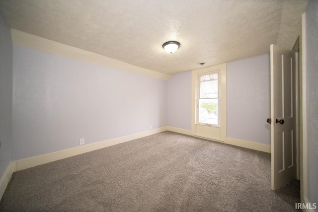 819 Spring St, New Castle, IN 47362 - carpeted empty room featuring a textured ceiling and baseboards