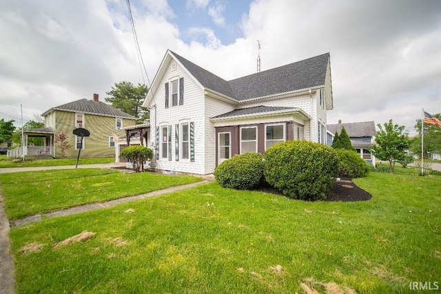 819 Spring St, New Castle, IN 47362 - rear view of house with a yard and a shingled roof