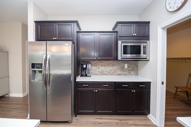 2184 Ringneck Rd, West Lafayette, IN 47906 - kitchen with appliances with stainless steel finishes, light wood-style flooring, light countertops, and backsplash