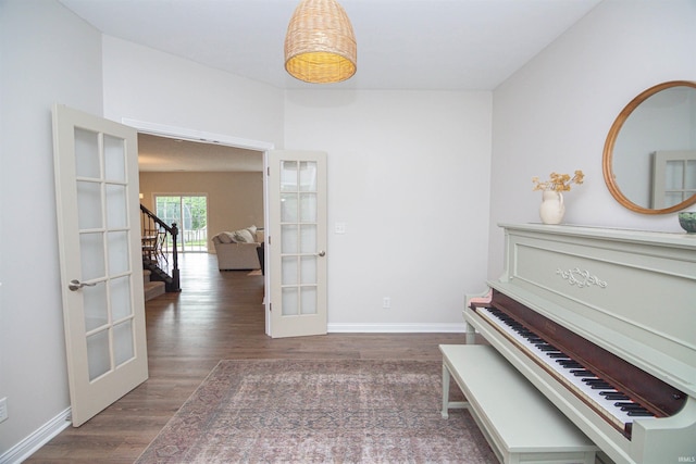 2184 Ringneck Rd, West Lafayette, IN 47906 - hallway featuring french doors, wood finished floors, baseboards, and stairway