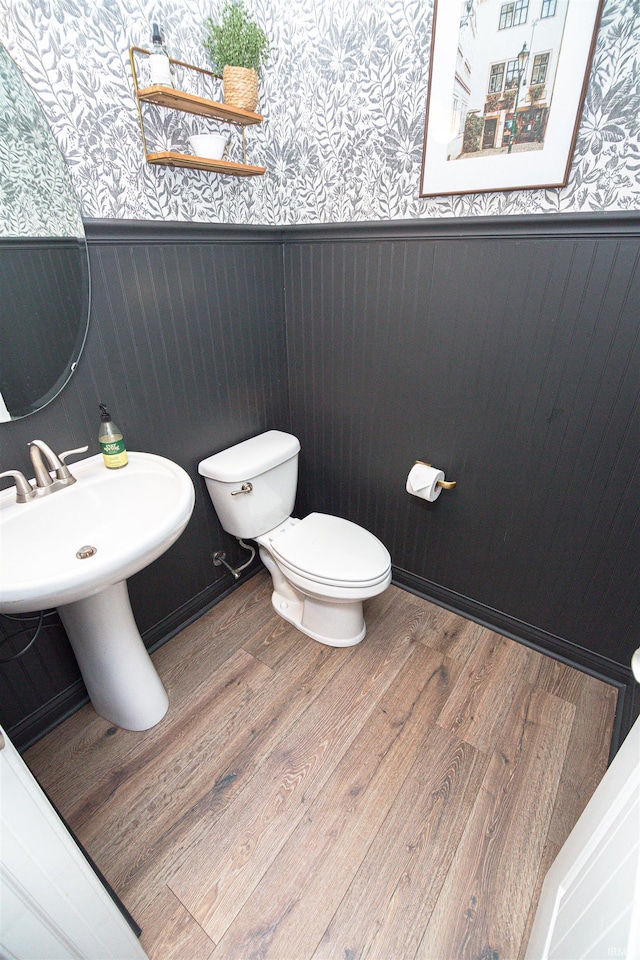 2184 Ringneck Rd, West Lafayette, IN 47906 - bathroom featuring wallpapered walls, a wainscoted wall, toilet, and wood finished floors