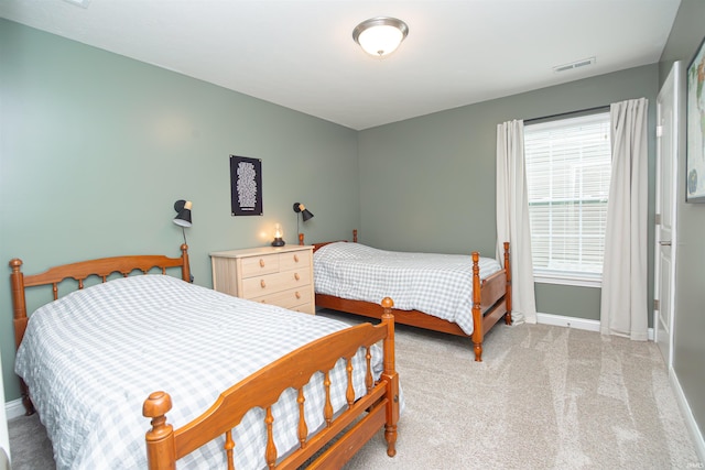 2184 Ringneck Rd, West Lafayette, IN 47906 - bedroom featuring baseboards and light carpet