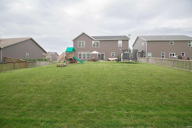 2184 Ringneck Rd, West Lafayette, IN 47906 - back of property featuring a trampoline and a playground