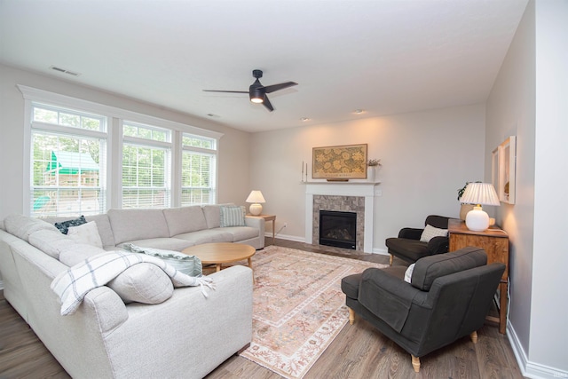 2184 Ringneck Rd, West Lafayette, IN 47906 - living room with ceiling fan, baseboards, wood finished floors, and a stone fireplace