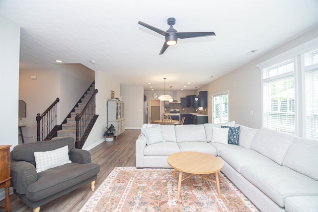 2184 Ringneck Rd, West Lafayette, IN 47906 - living area featuring stairway, wood finished floors, baseboards, ceiling fan, and recessed lighting