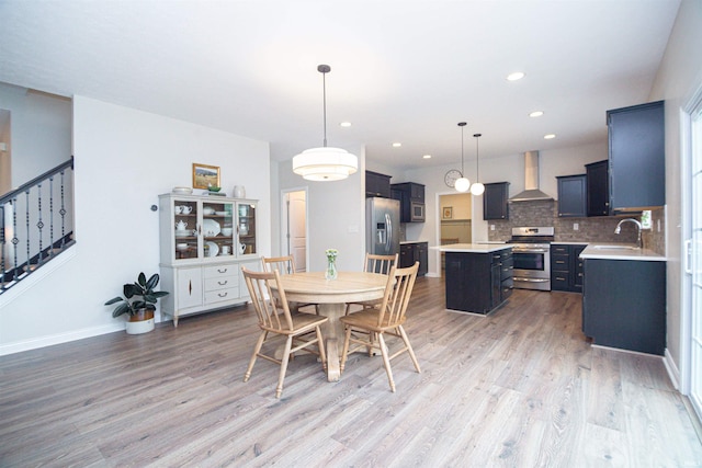 2184 Ringneck Rd, West Lafayette, IN 47906 - dining room featuring light wood finished floors, recessed lighting, baseboards, and stairs
