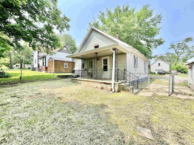 216 W Walnut St, Boonville, IN 47601 - shotgun-style home featuring covered porch and a chimney