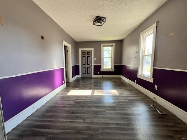 216 W Walnut St, Boonville, IN 47601 - empty room with a textured ceiling, wood finished floors, and baseboards