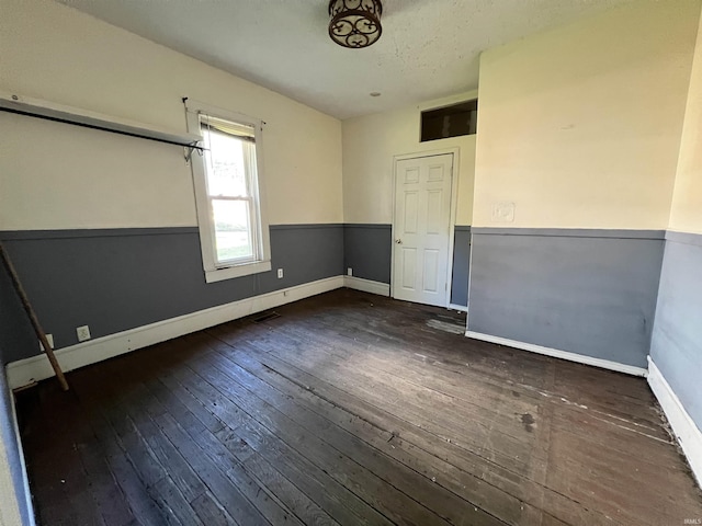 216 W Walnut St, Boonville, IN 47601 - spare room featuring hardwood / wood-style flooring and baseboards