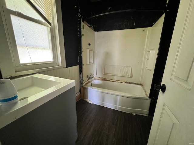 216 W Walnut St, Boonville, IN 47601 - bathroom with a wainscoted wall, shower / bathtub combination, wood finished floors, and vanity
