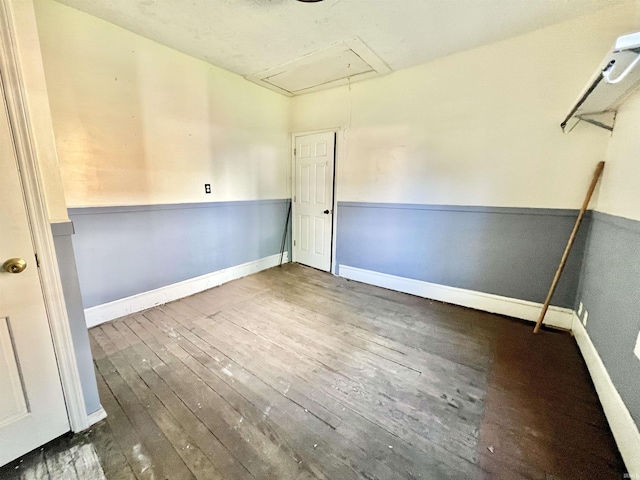 216 W Walnut St, Boonville, IN 47601 - spare room with attic access, hardwood / wood-style floors, and baseboards