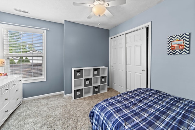 2034 Windflower Pl, West Lafayette, IN 47906 - bedroom with carpet floors, a closet, baseboards, a textured ceiling, and ceiling fan