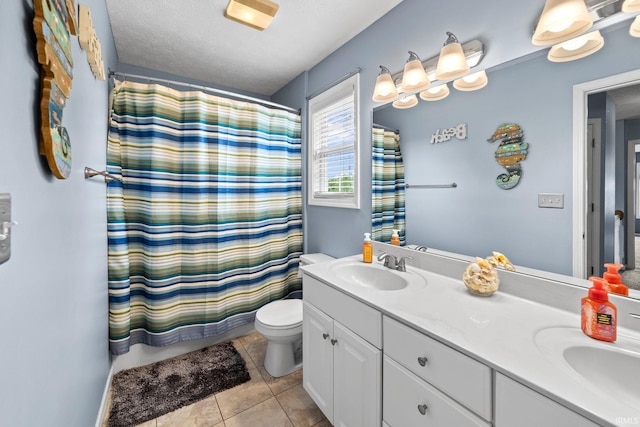 2034 Windflower Pl, West Lafayette, IN 47906 - full bath with toilet, double vanity, tile patterned flooring, a shower with shower curtain, and a textured ceiling