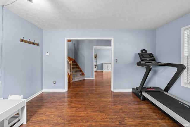 2034 Windflower Pl, West Lafayette, IN 47906 - exercise room with wood finished floors, baseboards, and a textured ceiling