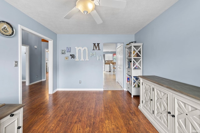2034 Windflower Pl, West Lafayette, IN 47906 - spare room featuring a ceiling fan, wood finished floors, and baseboards